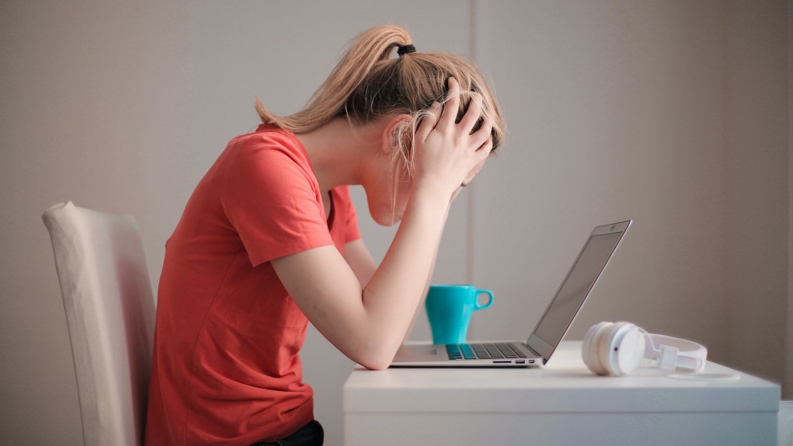 Student experiencing test anxiety at her desk