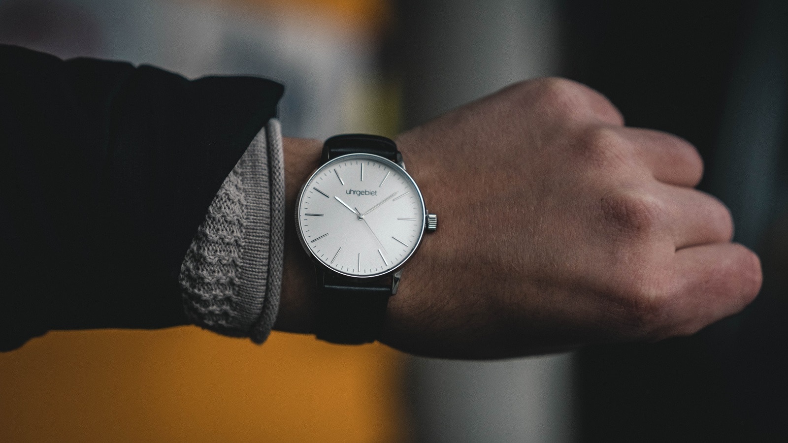 man looking at watch