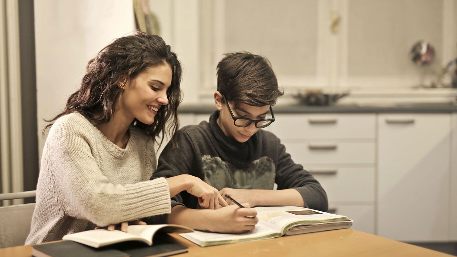 A teacher tutoring a student