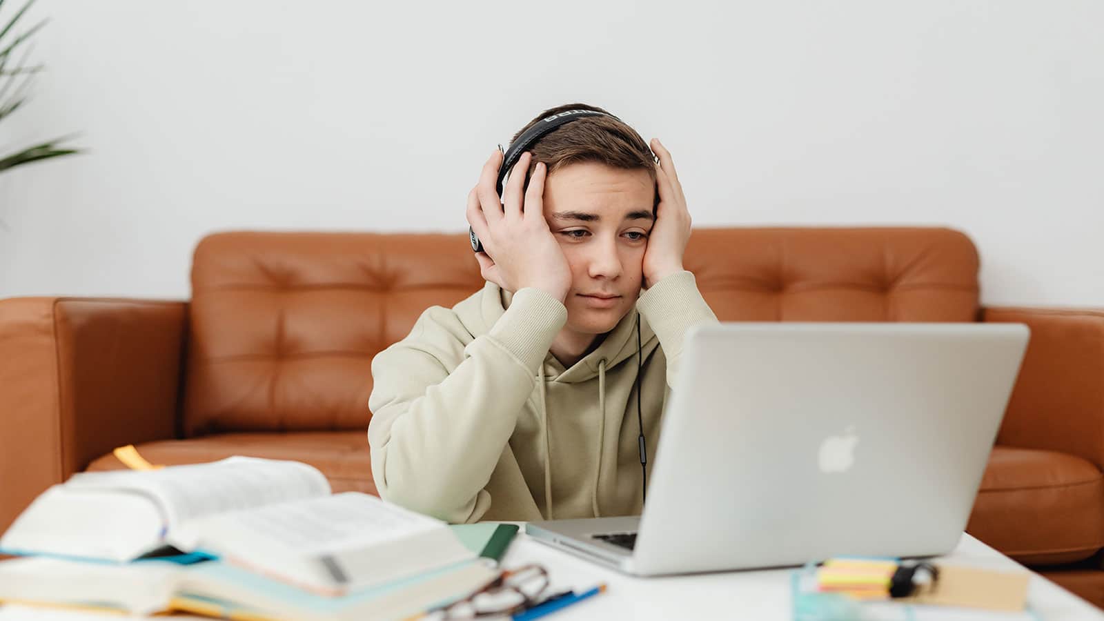 Stressed student looking at laptop