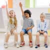 Children Raising Their Hands in a Classroom