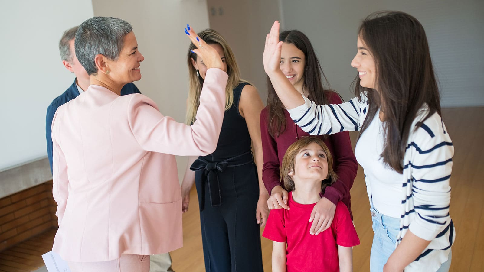 Women doing high fives