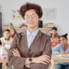 Woman standing in front of students seated at individual desks